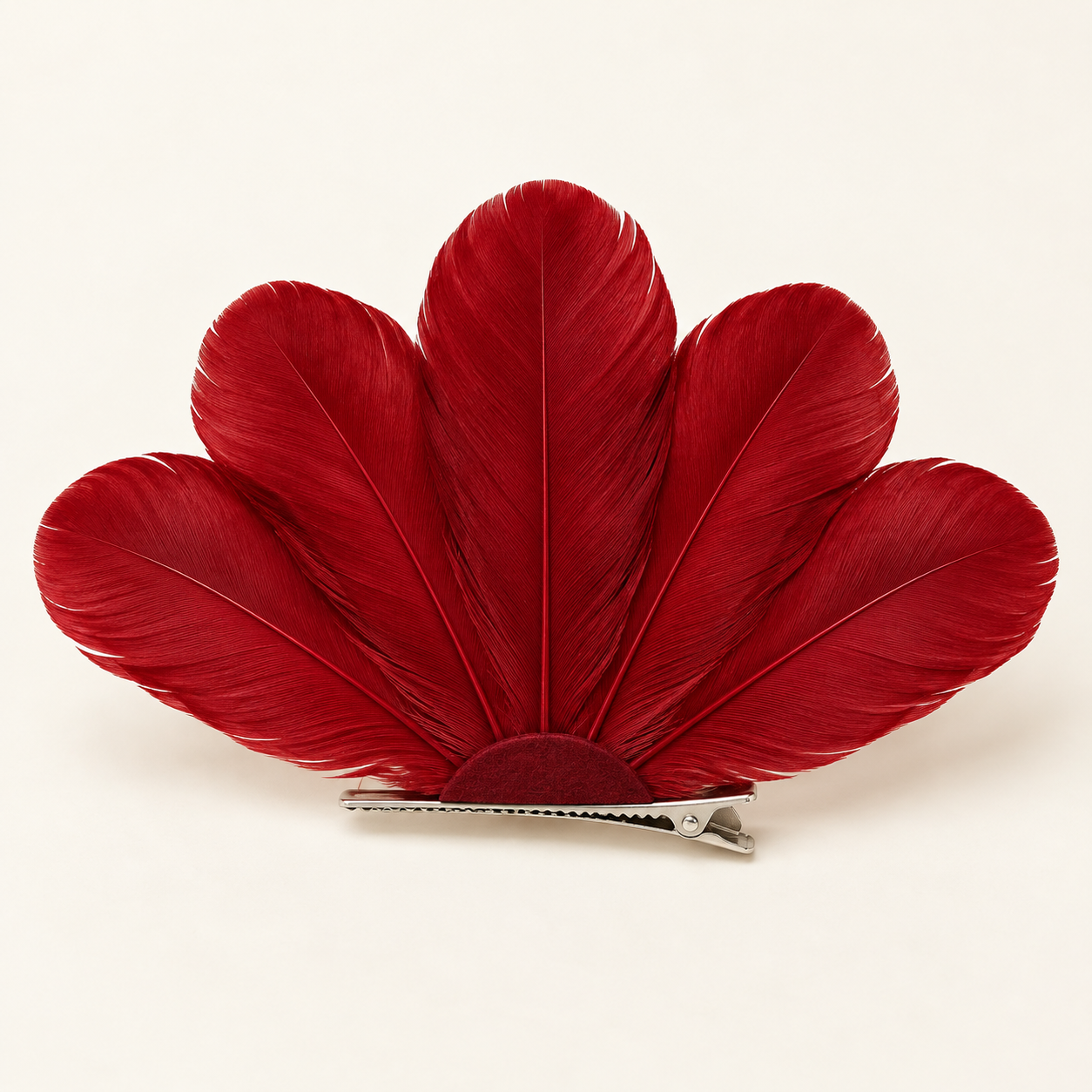 Abanico Rouge: Five broad deep red feathers open into a fan silhouette.