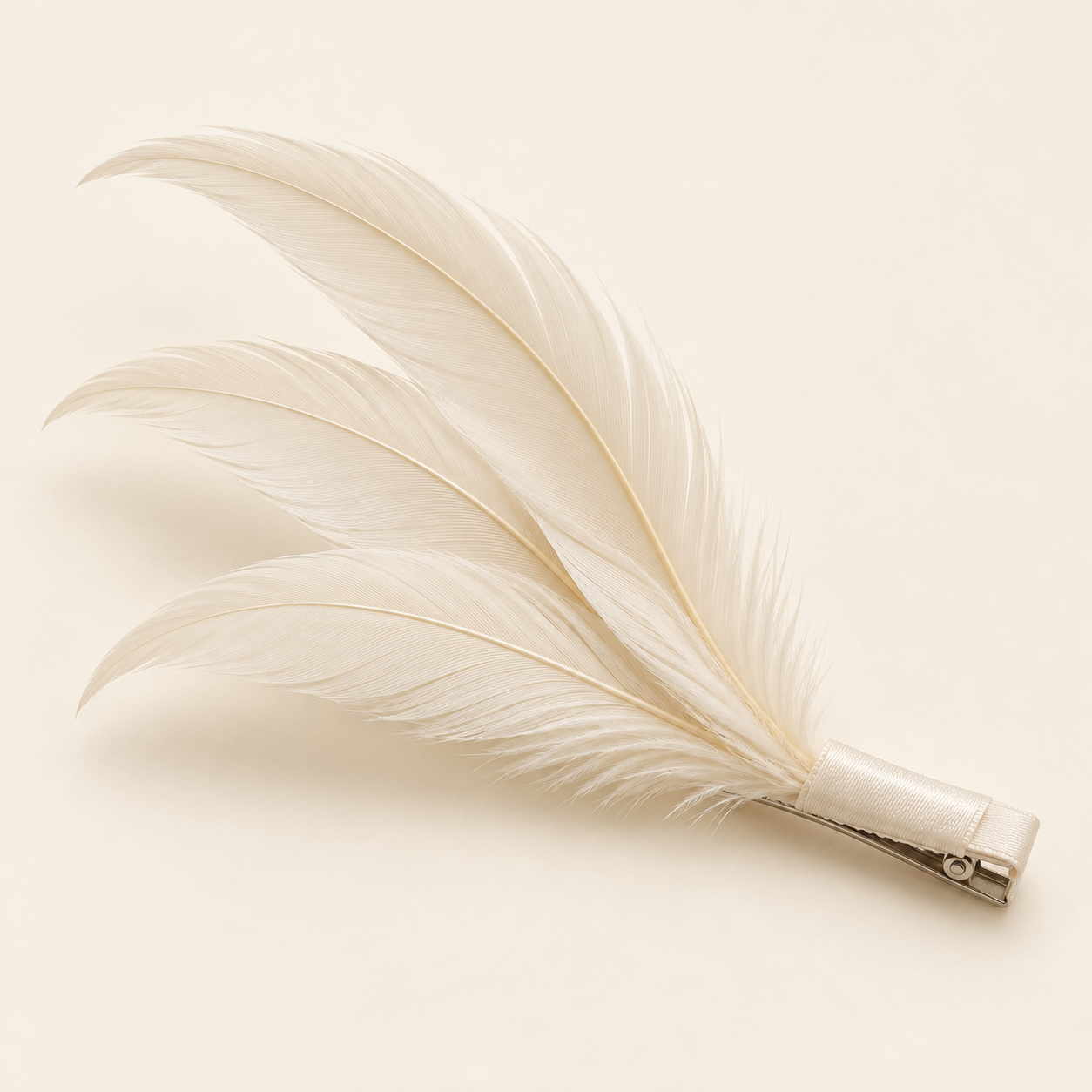 Alba Ivory: Three slender ivory feathers in a diagonal sweep.